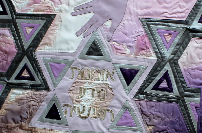 Artwork that depicts the hand of God with star of David