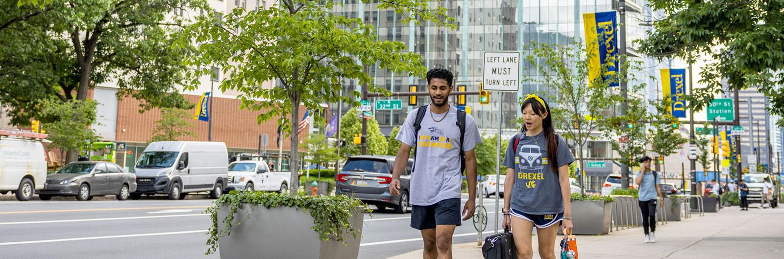 Two Drexel students walking down Market Street